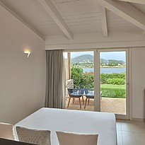 King Deluxe Lagoon View - Baia di Chia Resort, Curio Collection by Hilton